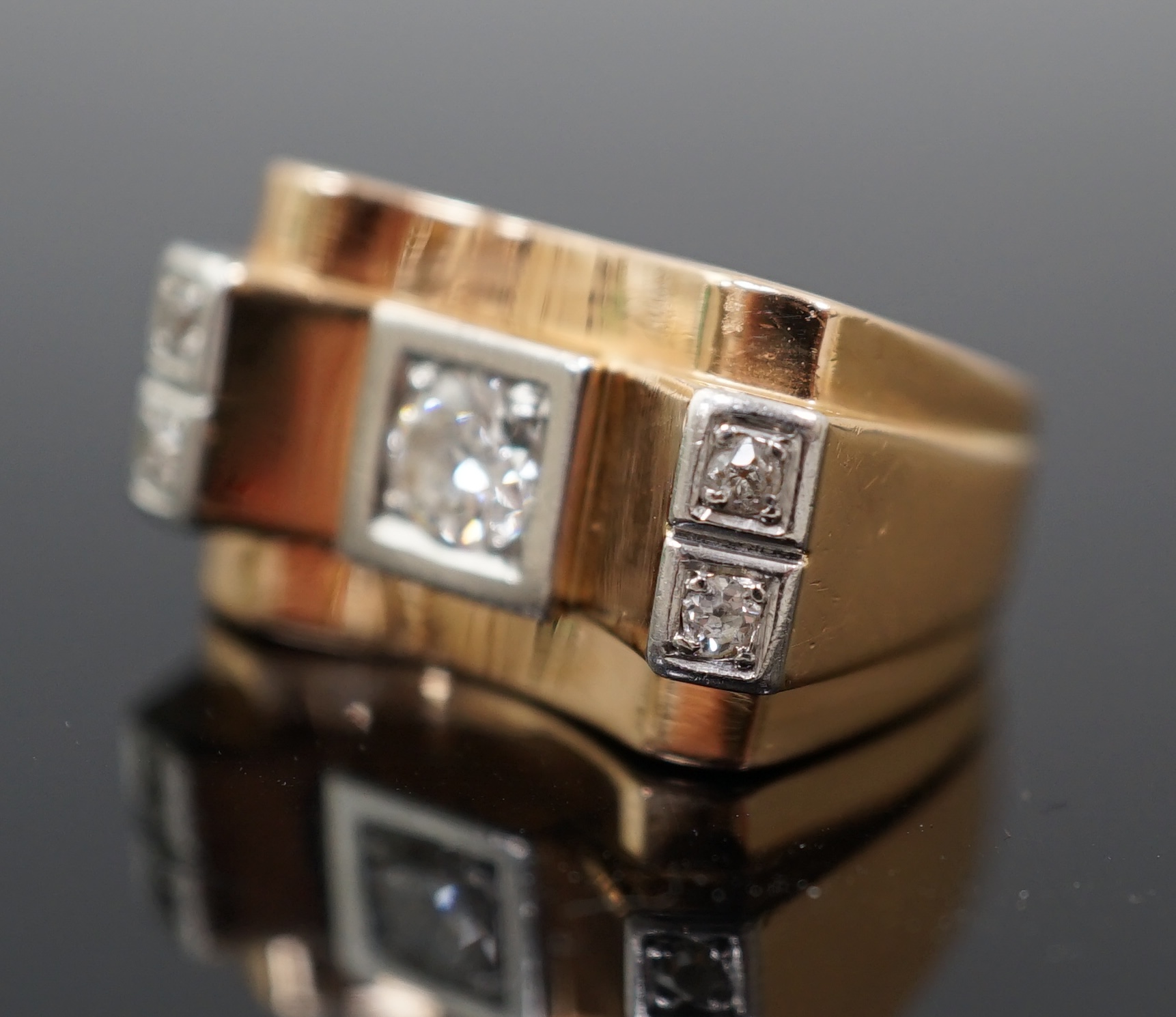 A 1940's 18ct gold and four stone diamond set 'tank' dress ring
